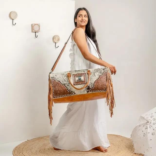 Cowhide duffel bag ships October