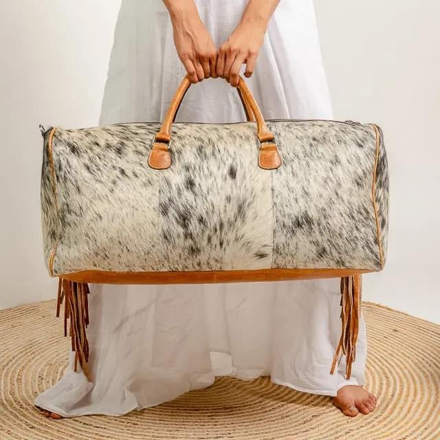 Cowhide duffel bag ships October
