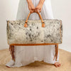 Cowhide duffel bag ships October