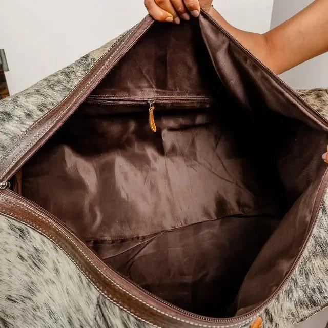 Cowhide duffel bag ships October